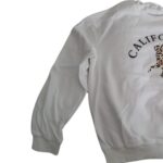 Poleron infantil blanco con diseño de leopardo y texto "CALIFORNIA" - Imagen 2