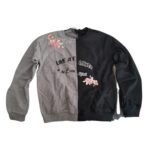 Poleron bicolor infantil con diseño floral y frases en el frente