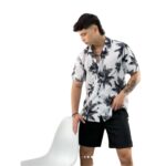 Conjunto tela chaliz antifluido blanco con estampado de palmeras negras